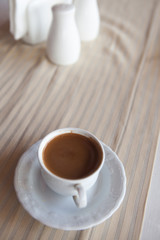 cup of coffee on the table in pavement cafe
