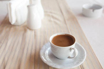 cup of coffee on the table in pavement cafe
