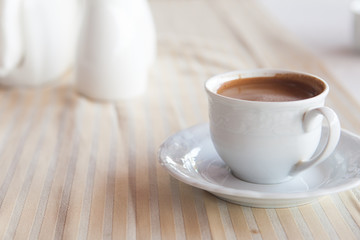 cup of coffee on the table in pavement cafe
