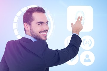 Composite image of smiling businessman pointing these fingers