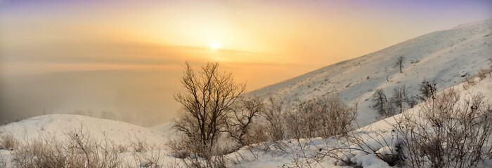 Winter sunset / View of Winter sunset  through the frosty mist in the hills of Bashkiria