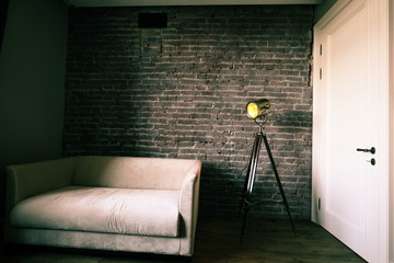 loft with lamp and sofa