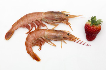 two prawns and a strawberry