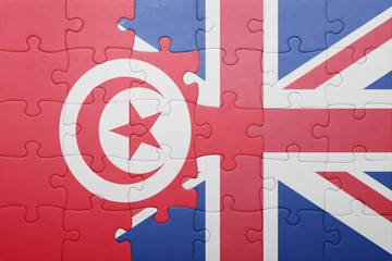 puzzle with the national flag of great britain and tunisia