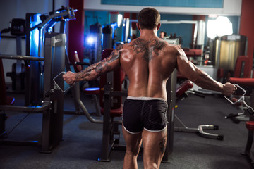 Fototapeta na wymiar Fit Athlete. Muscular man working Out
