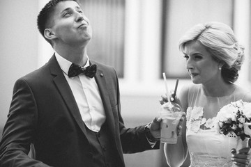 Happy young couple drinking ice coffee