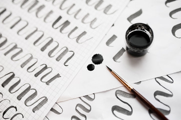 learning calligraphy - paper with example and brush and ink