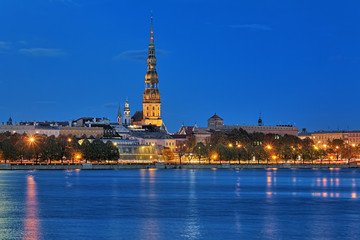 Fototapeta na wymiar Evening view of the St. Peter's Church from the shore of Daugava in Riga, Latvia