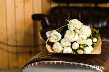 Luxury bouquet of white peonies at interior