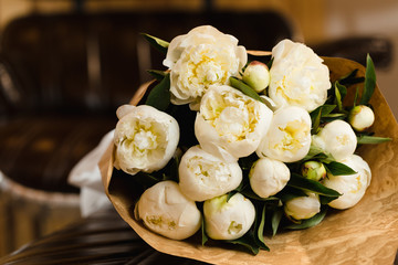 Luxury bouquet of white peonies at interior
