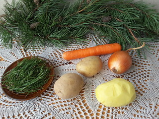 Fototapeta na wymiar Cooking vegetarian healthy food with pine needles