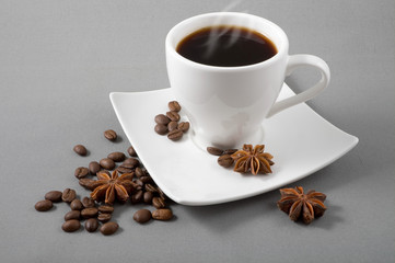  coffee, grains, anise on a grey background