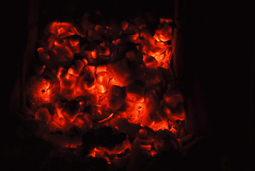 red hot coals on black