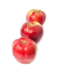 three red apples on a white background