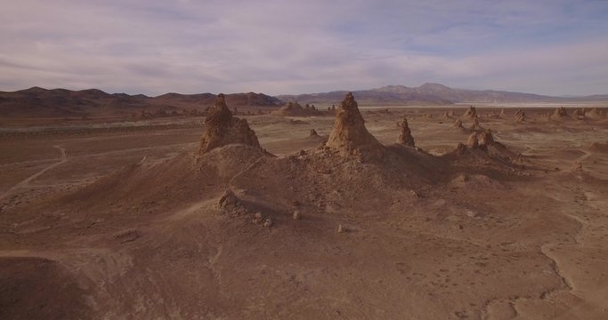 Between Rock Structures / Aerial flight going in between two rock structures in a desert.