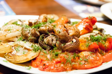 vegetables grilled on a brazier on a white plate