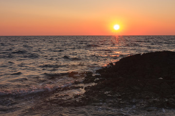 Fototapeta premium Sunset over the sea during summer evening in Croatia