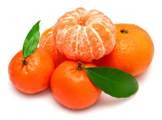 Mandarin with leaf and slices of peeled tangerine