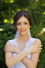 Naklejka premium Bride with beautiful eyes at a wedding a walk in the woods