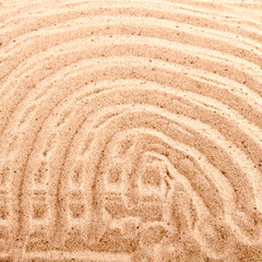 Fototapeta na wymiar background of the lines on the beach sand with