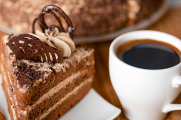 Fototapeta na wymiar coffee ,a slice of cake on a plate
