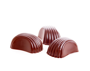 three chocolates isolated macro