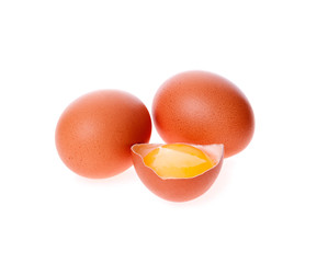 half of the broken eggs and egg yolk on the background of two in