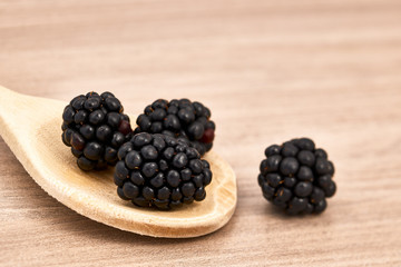 blackberries on a wooden spoon