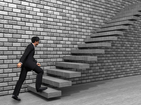 Conceptual business man climbing a stair