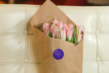 Flower bouquet of pink tulips on pastel background