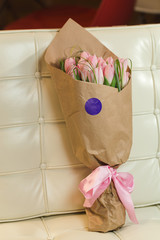 Flower bouquet of pink tulips on pastel background