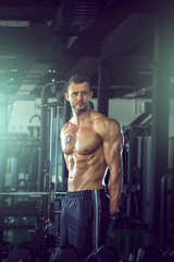 Fototapeta na wymiar Man posing in gym