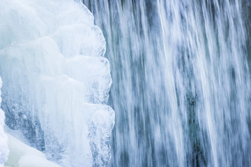 Fototapeta na wymiar Icicles formation in waterfall
