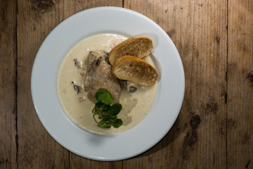 Lapin à la moutarde, from above. A classic French dish of rabbit in a mustard sauce

