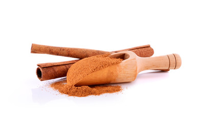 Cinnamon sticks and powder on white background