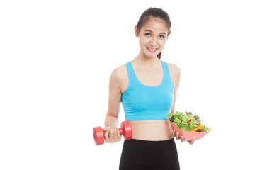 Beautiful Asian healthy girl with dumbbell and salad