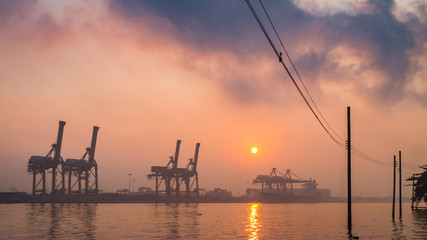 Fototapeta na wymiar Khlong Toei port among the mist in the morning