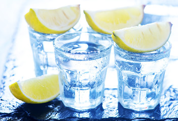 tequilla with lime and on a table