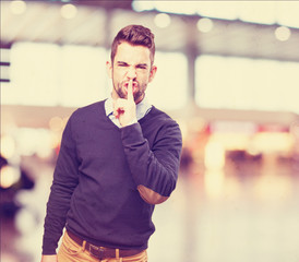 Naklejka premium man doing a silence sign