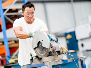 Asian worker in production plant on the factory floor