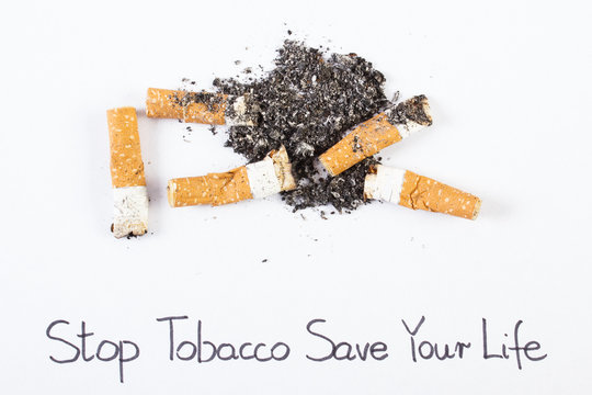 Cigarette butts and ash, stop tobacco save your life