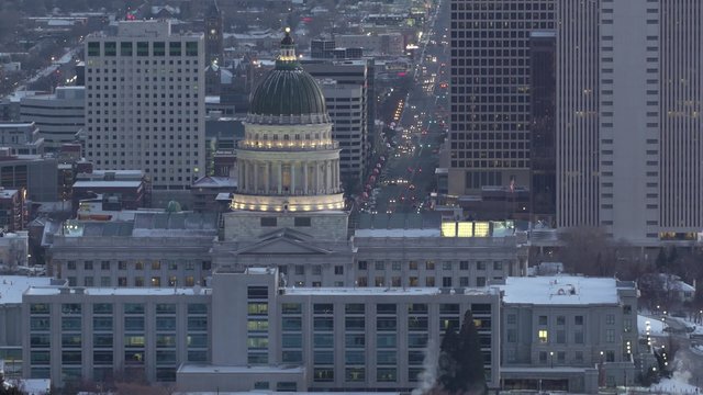 Lights shine as traffic moves toward the Utah state capital in downtown Salt Lake City, UT.