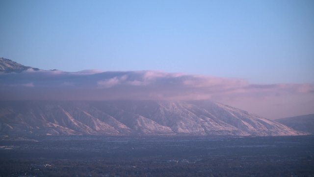 The Wasatch mountain range over looks the Salt Lake City valley at sunset.