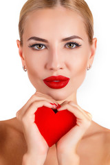 Beautiful woman with glamour bright makeup and red heart