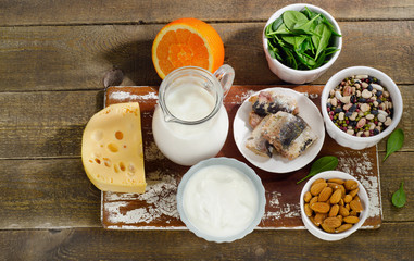 Foods Highest in Calcium on wooden table.