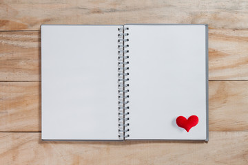 notebook with red heart on wood table ,Valentines background