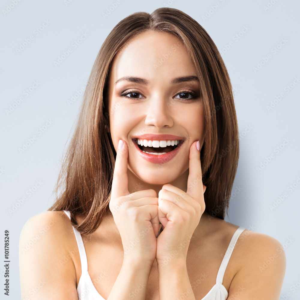 Wall mural young woman showing smile