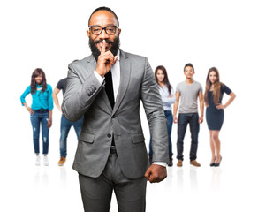 business black man doing a silence gesture