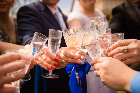 Cheers! Friends Celebrating A Wedding  Party And Clinckind Glass