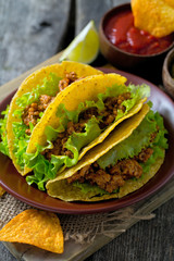 plate of tacos, nachos and dips